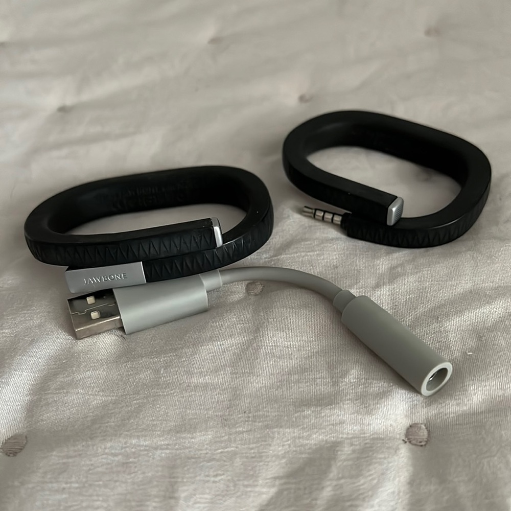 Set of 2 Jawbone fitness trackers, 1 sz S/M (no cover) & one sz M/L +one charger